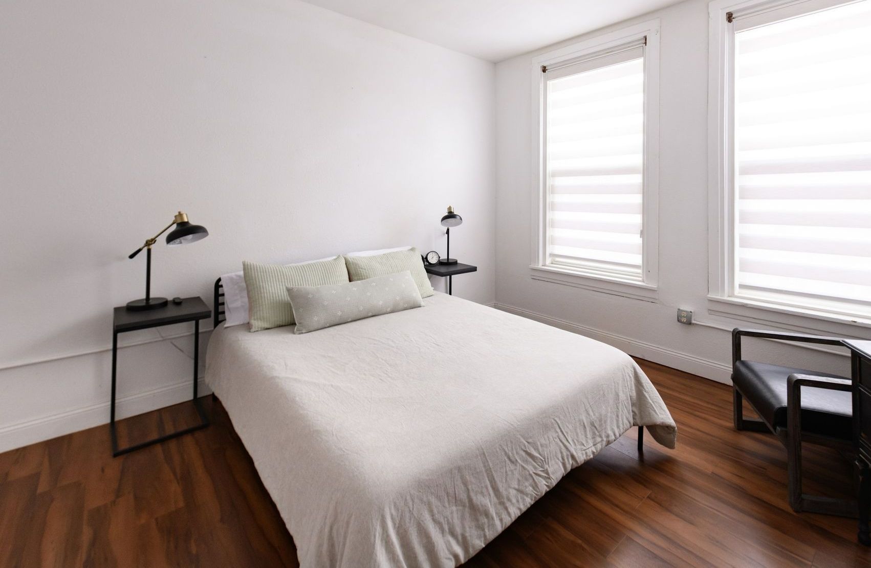 Photo showing a bedroom with a tall window