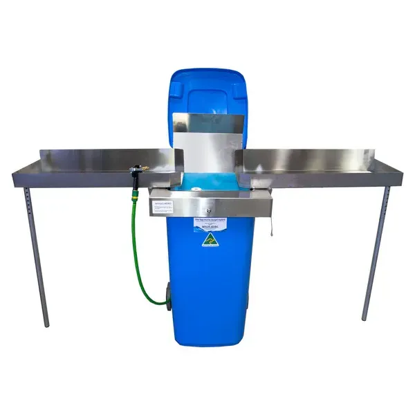 A Blue Trash Can is Attached to a Stainless Steel Table — North Coast Plaster Solutions in Lismore, NSW