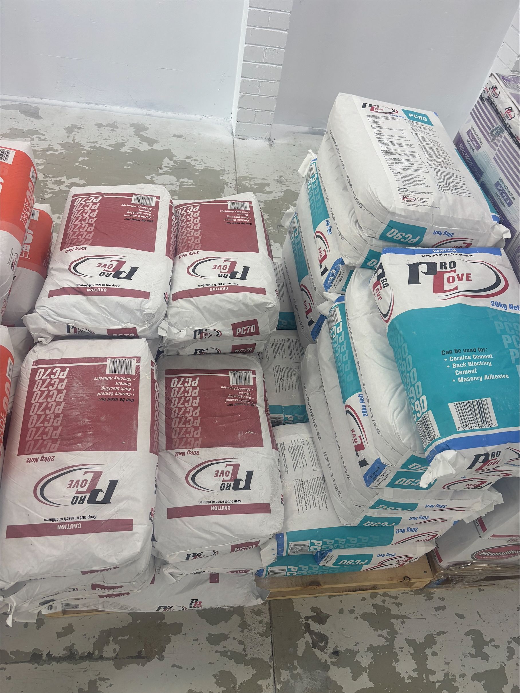 A Stack Of Plastering Packages On Top Of A Crate  — North Coast Plaster Solutions in Lismore, NSW