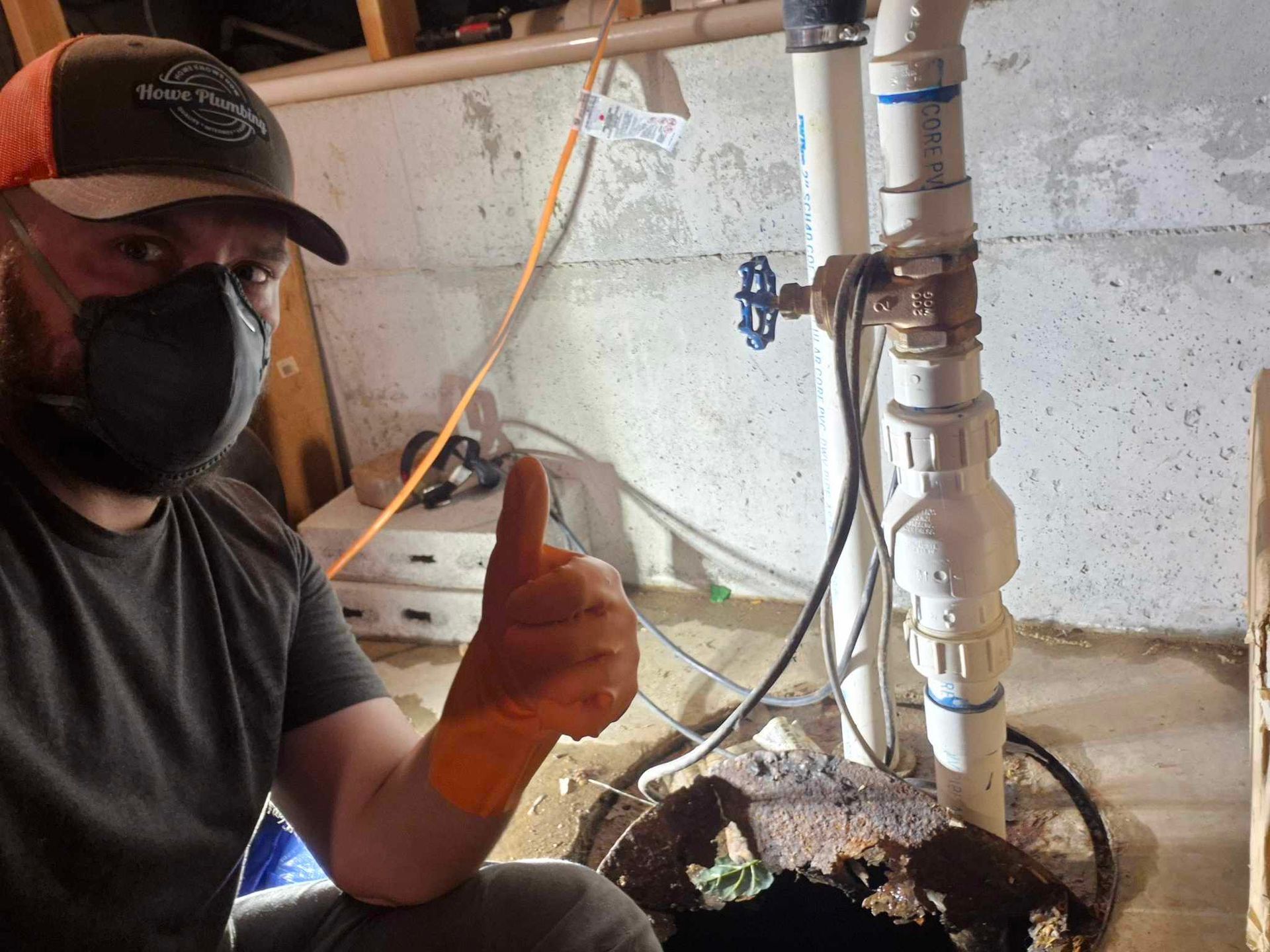 A white sink with a chrome faucet on it