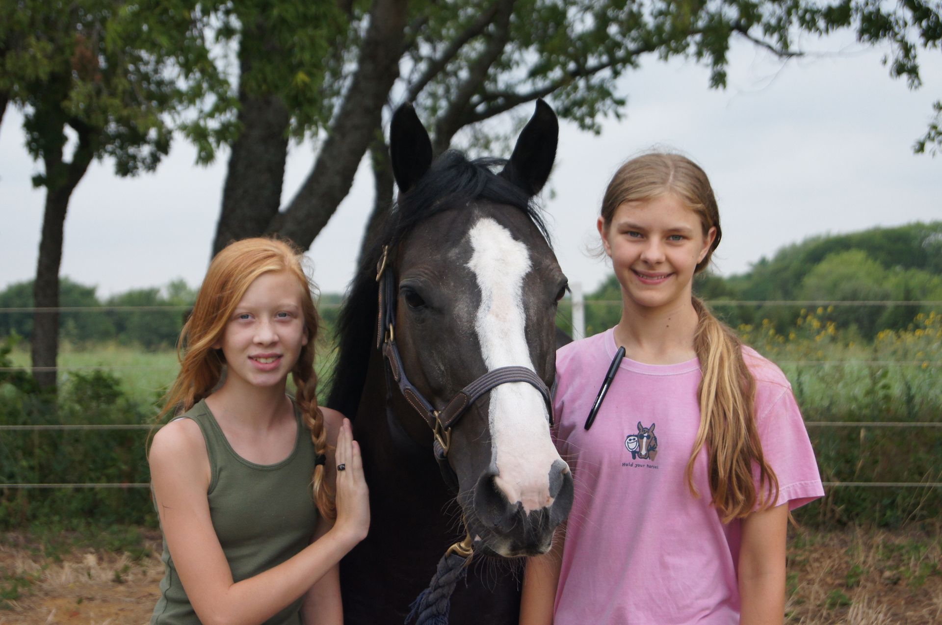 Two girls are posing for a picture with a horse - Anna, TX - Spirit Song Youth Equestrian Academy