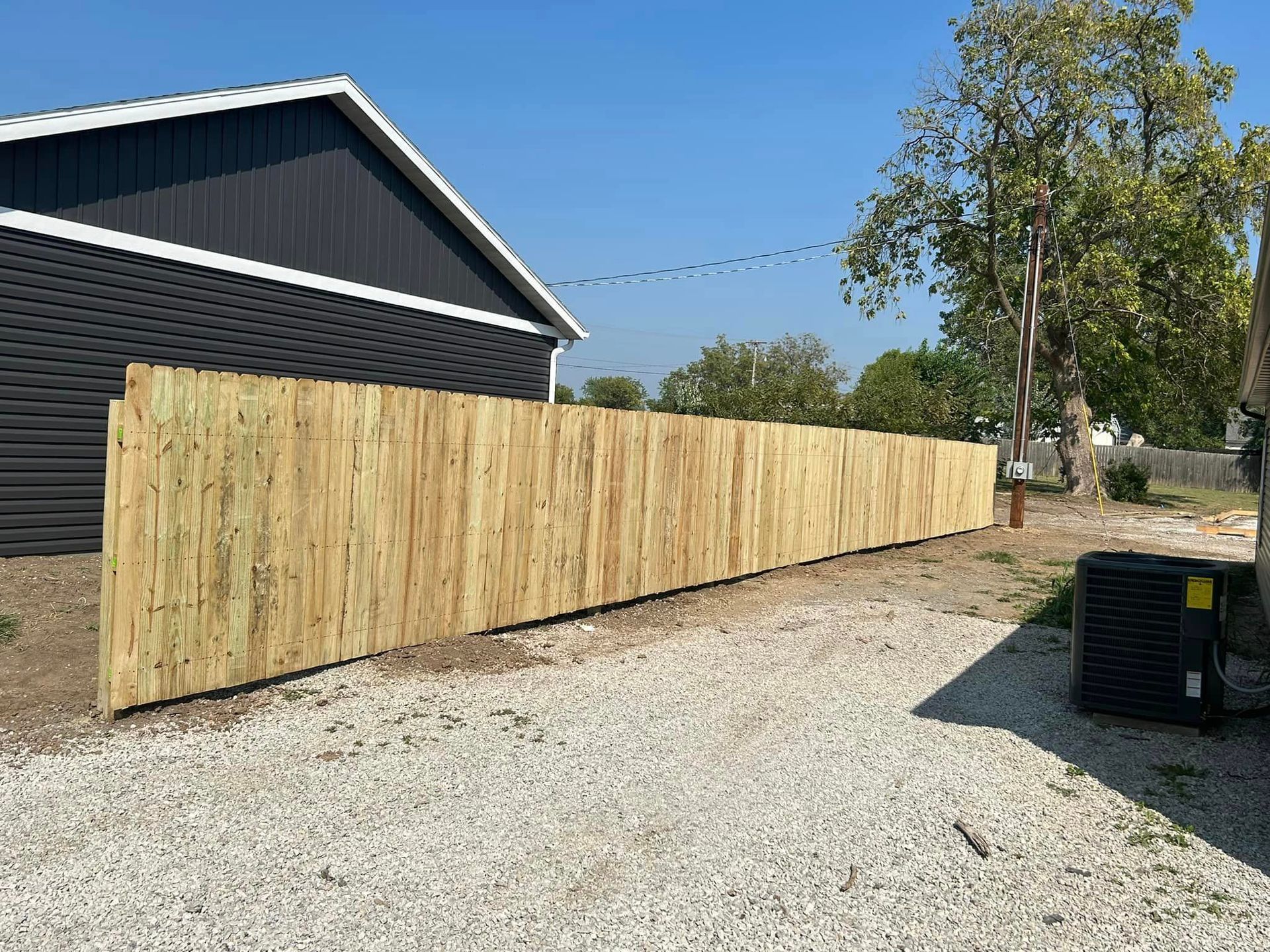 wooden privacy fence installation