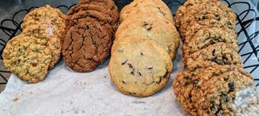 There are many different types of cookies on the table.