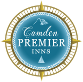 The logo for camden premier inns has a compass on it