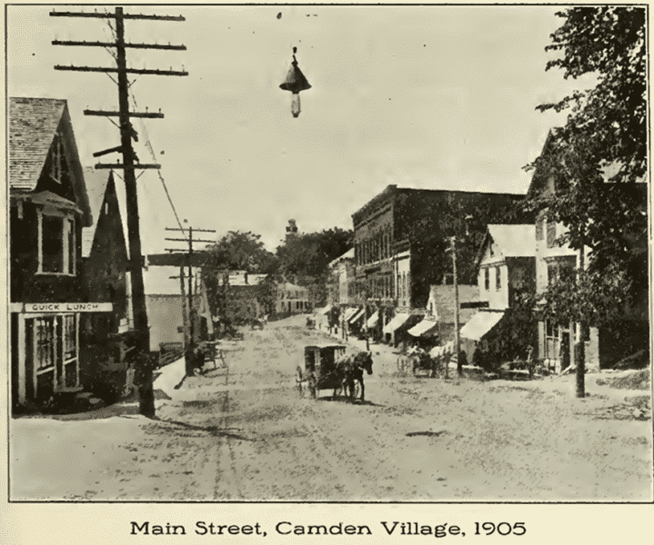 A black and white photo of main street camden village 1905
