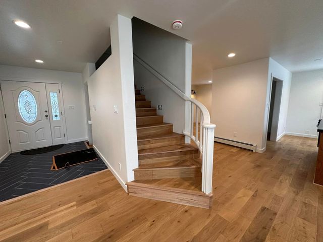 Bathroom with green vanity and gold fixtures