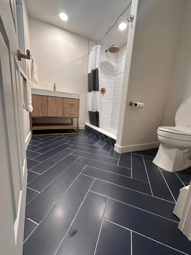 Spacious bedroom with large windows and natural light