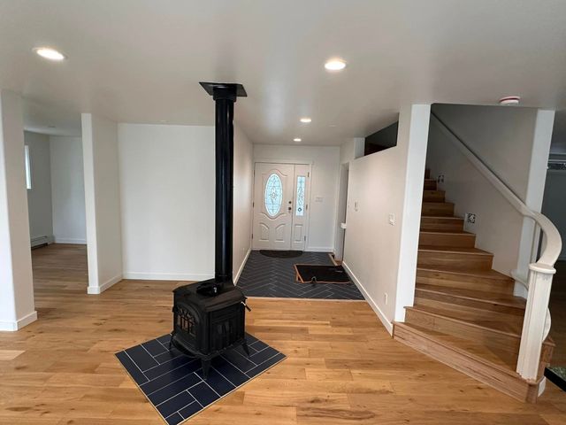 Kitchen with wood cabinets and farmhouse sink