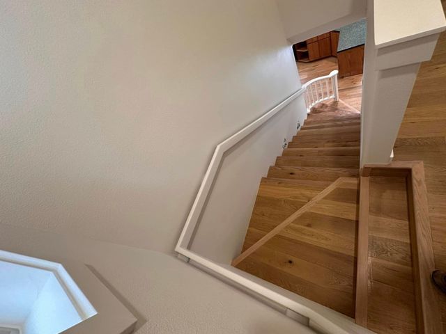 Custom staircase with white railing detail