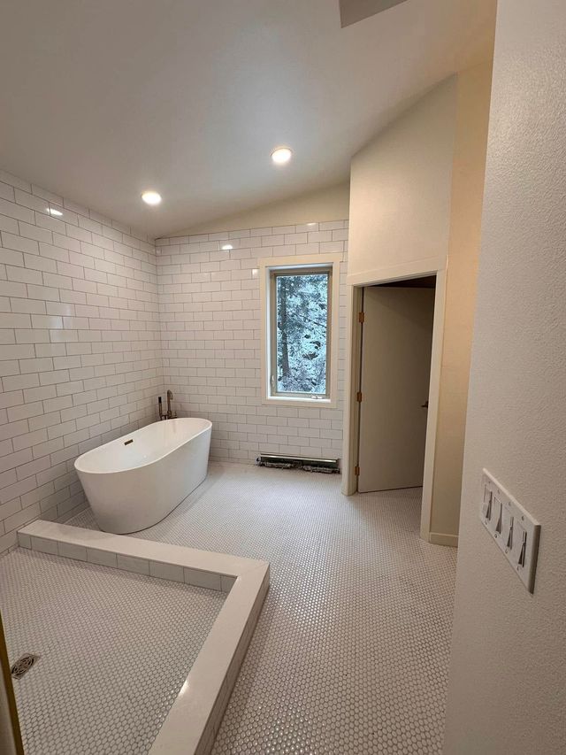 Entryway with hardwood floors and staircase