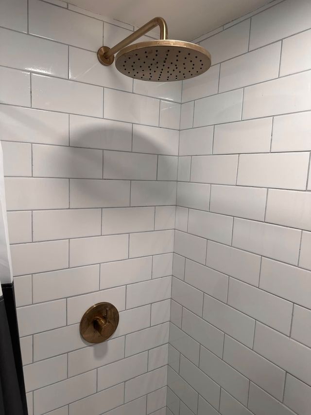 Modern shower with gold waterfall showerhead