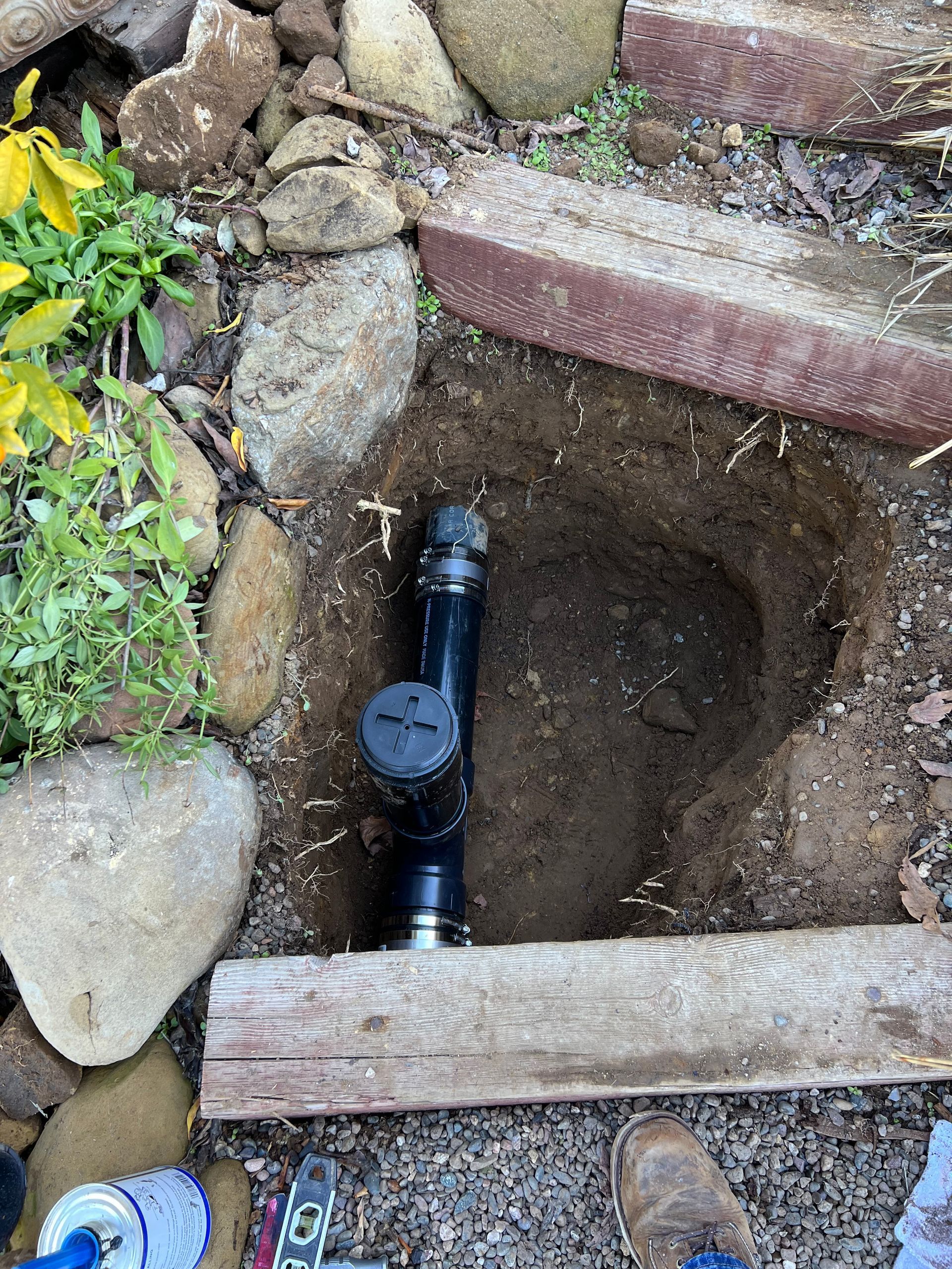 A Pipe Is Being Installed In A Hole In The Ground - Oxnard, CA – 4J's Plumbing And Drain Cleaning