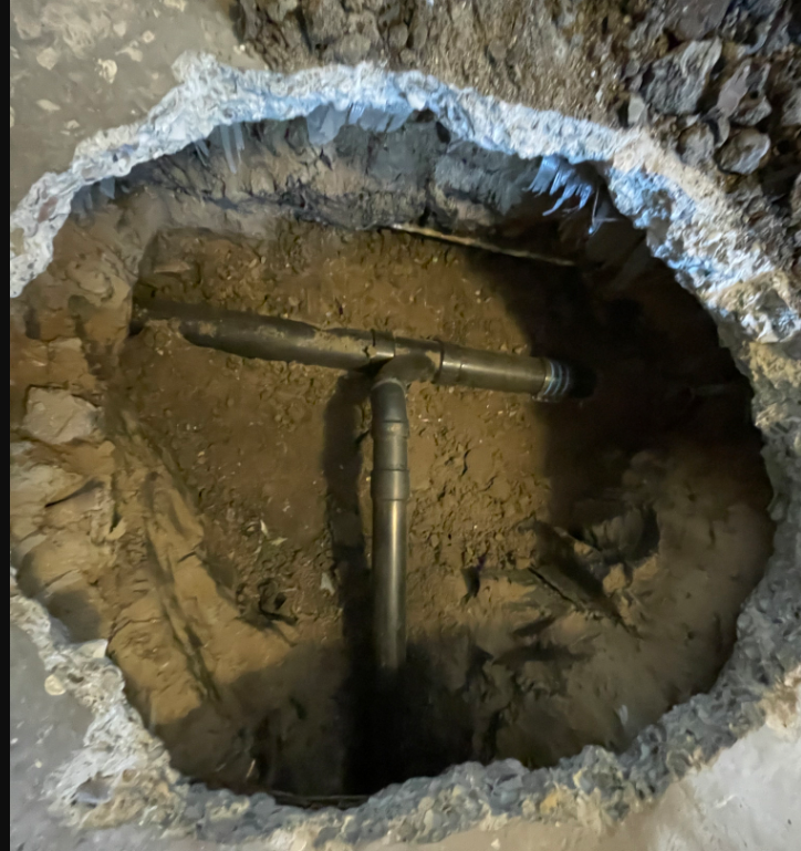 A Hole In The Ground With A Metal Pipe In It - Oxnard, CA - 4J's Plumbing And Drain Cleaning