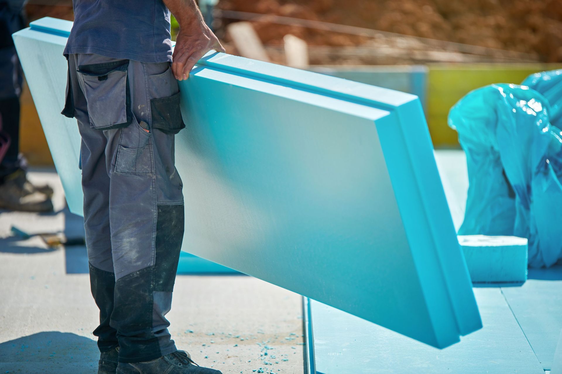 man working thermal insulation building construction