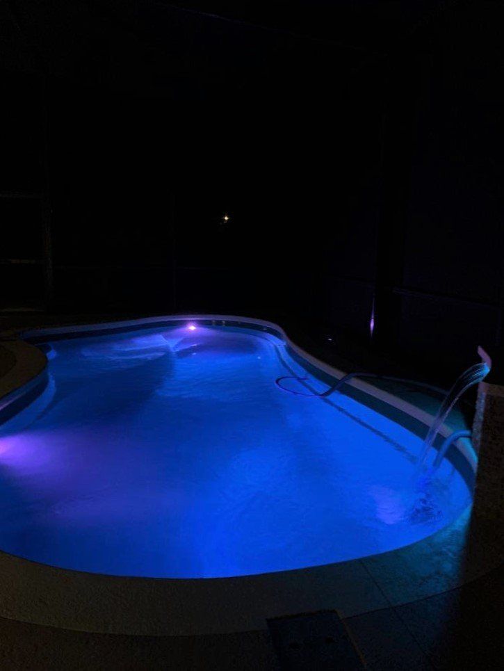 Pool with Lights at night — Gainesville, FL — Florida Leisure Pool & Spa