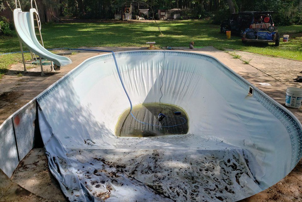 Unused Pool with Slide Before — Gainesville, FL — Florida Leisure Pool & Spa