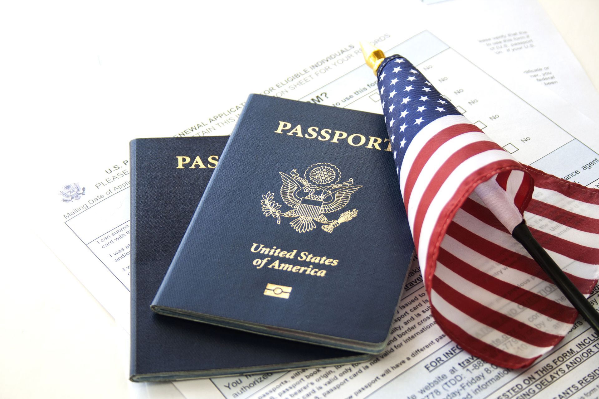 Two Passports and an American Flag — West Palm Beach, FL — Law Offices of J. Mentor, PLLC