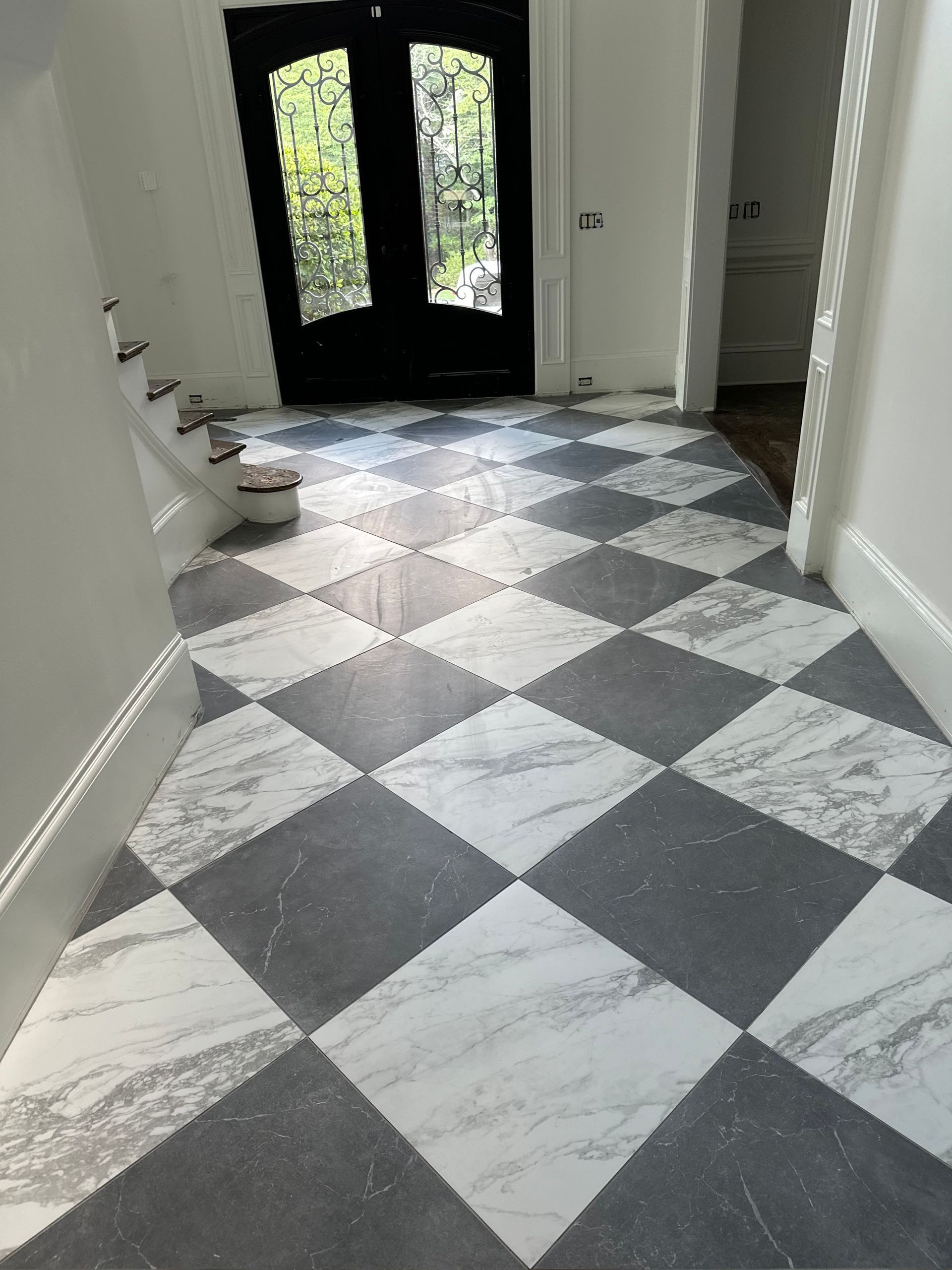 A black and white checkered floor in a hallway