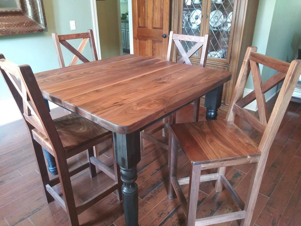 A Wooden Table And Chairs In A Dining Room