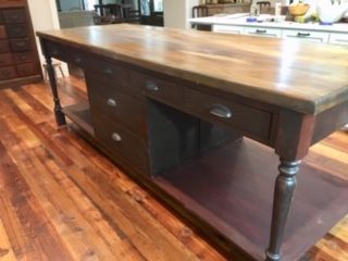 A Wooden Table With Drawers