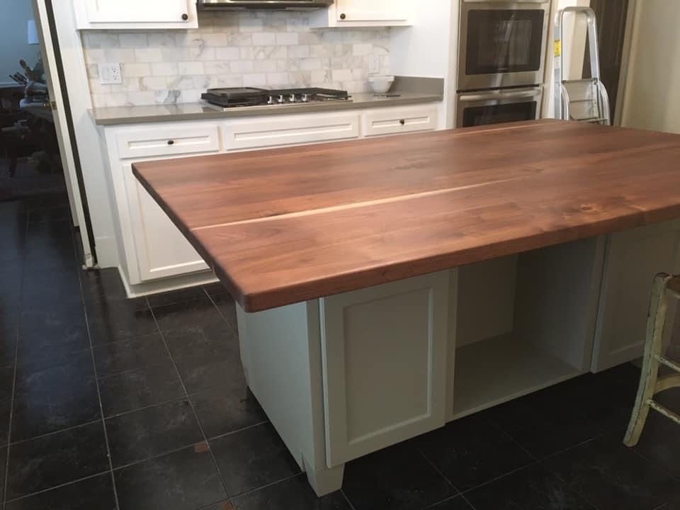 A Kitchen With A Wooden Counter Top