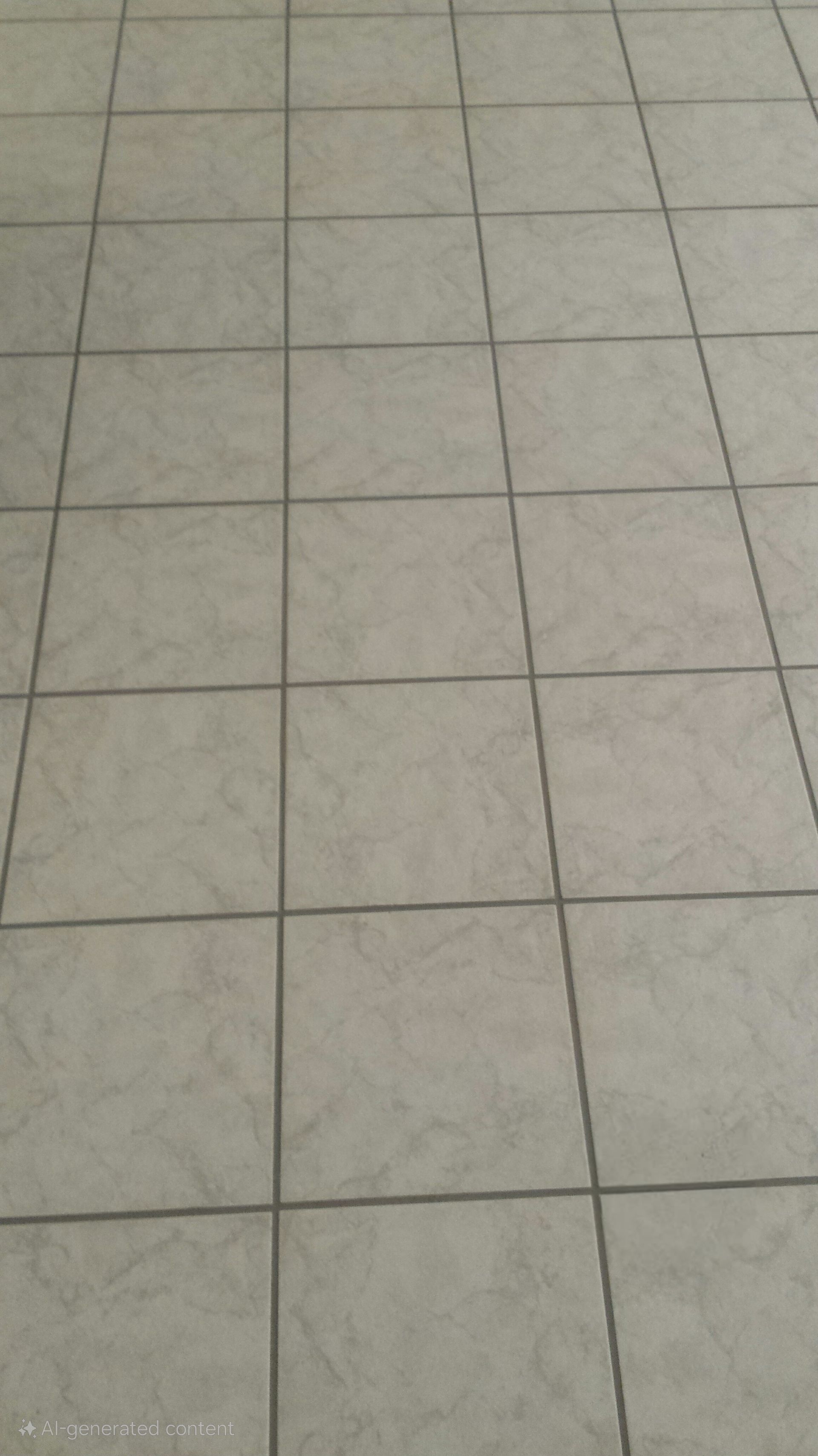 A close up of a tiled floor with a diagonal pattern
