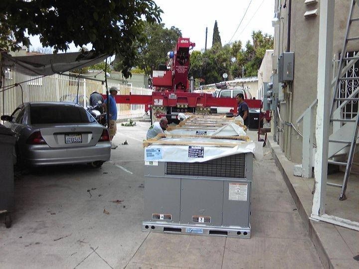 A silver mercedes is parked in a parking lot