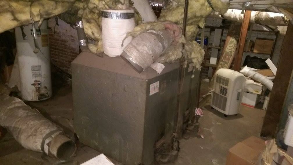 There is a heater in the corner of the room.