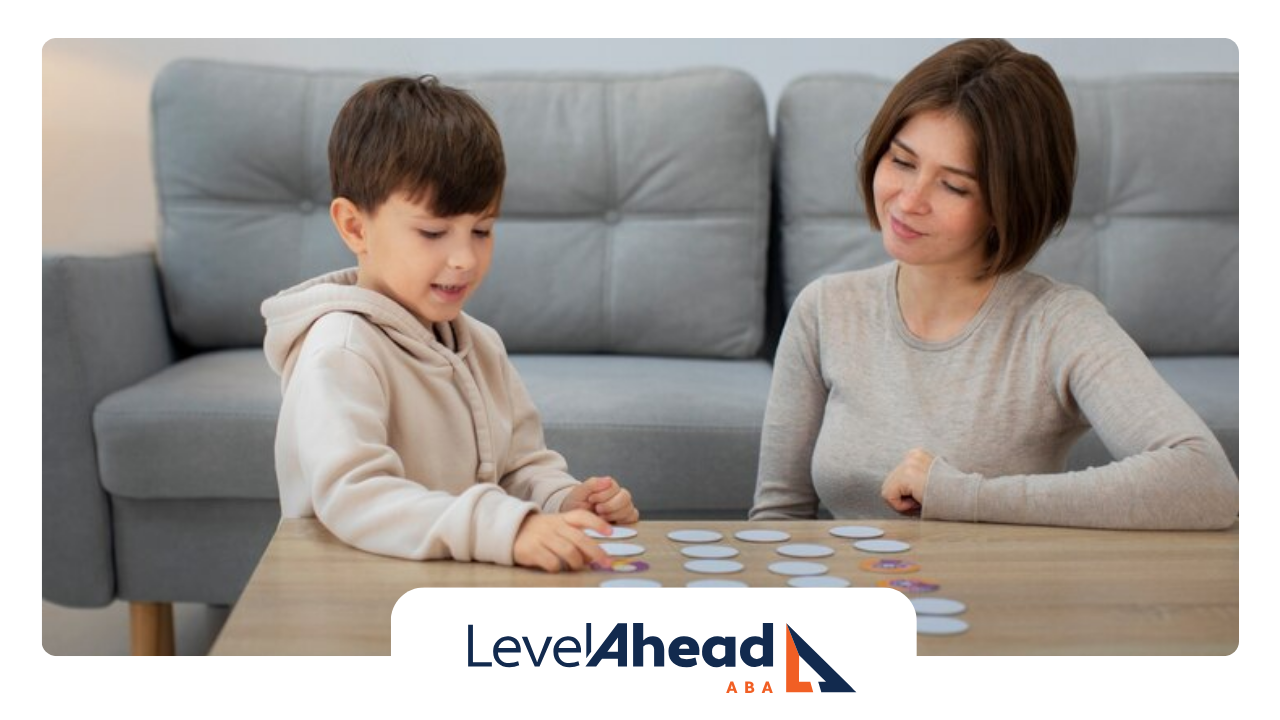 An RBT and a child are playing an activity game during their ABA therapy session