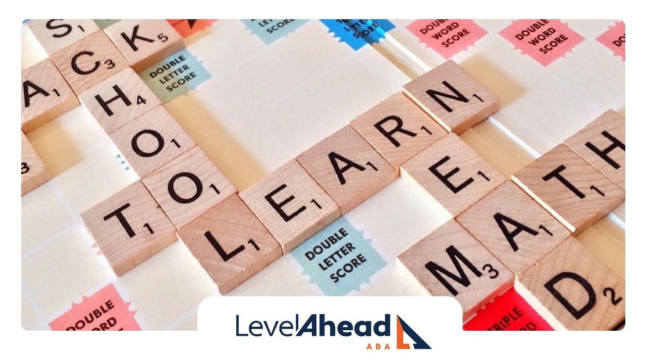 Close-up of Scrabble tiles spelling out words like 'School' and 'Learn' on a game board in Georgia.