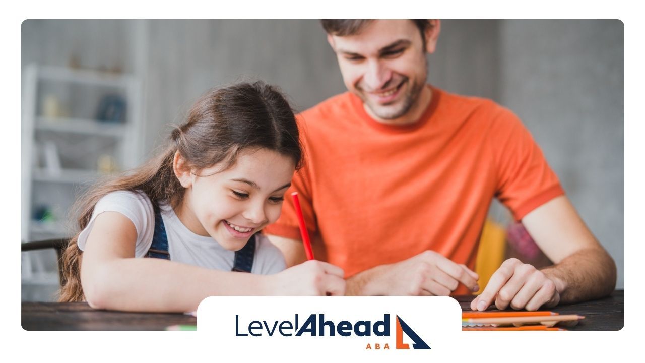 A man is helping a little girl with her homework.