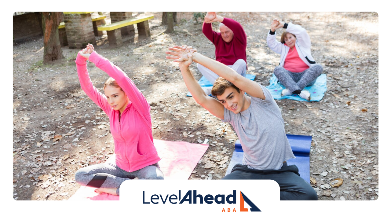 A group of autistic individuals doing yoga stretching