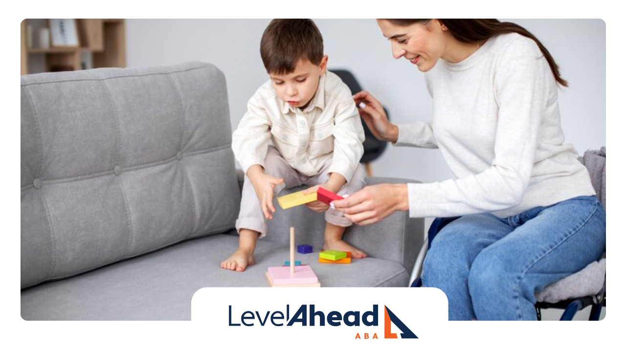 An RBT is sitting on a couch playing with a child during their ABA therapy session.