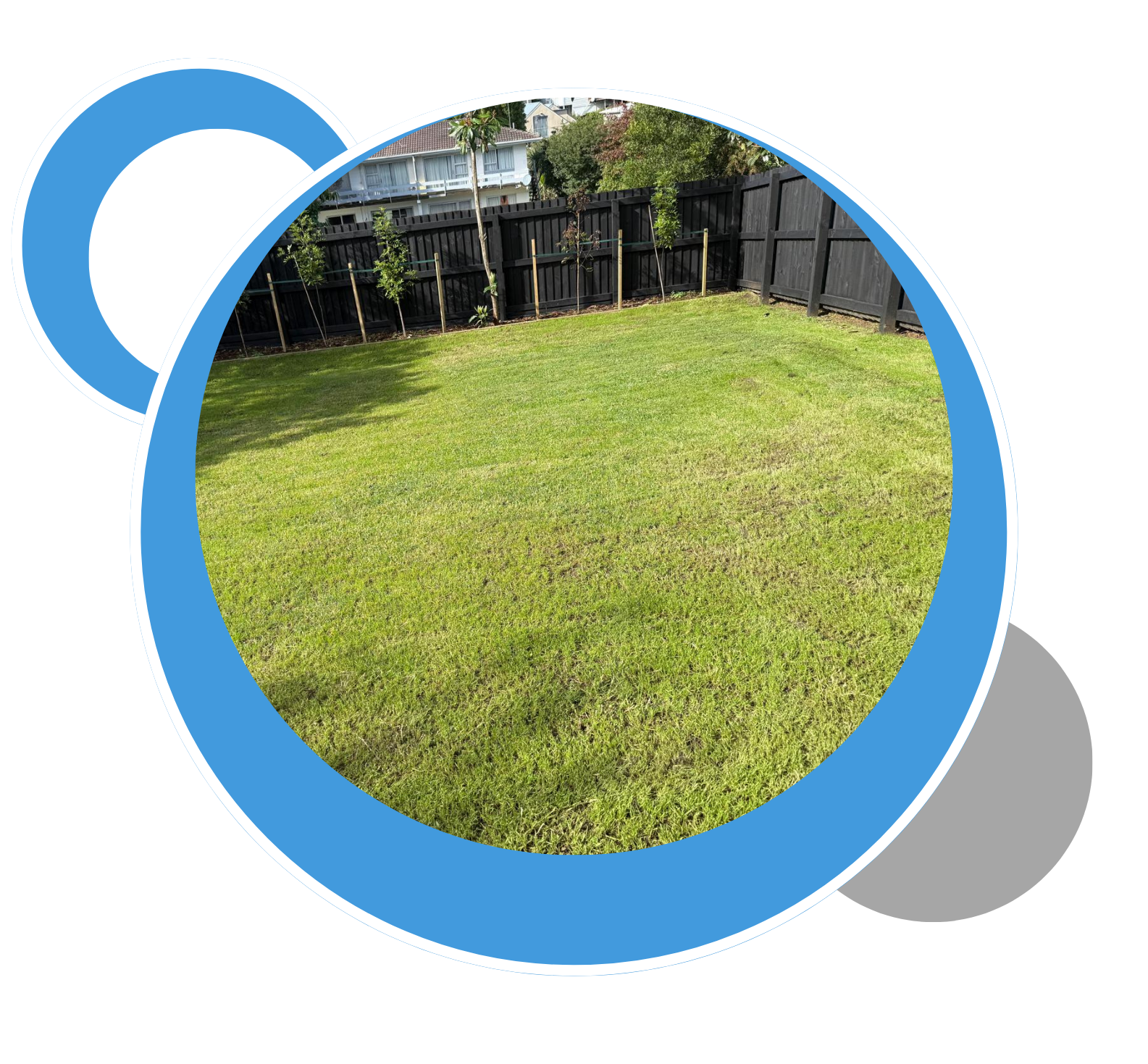 A picture of a fence and a lawn in a blue circle A picture of a fence and a lawn in a blue circle