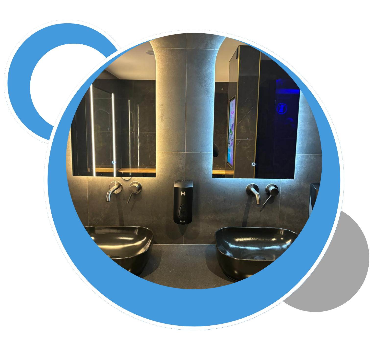 A bathroom with two sinks and a large mirror