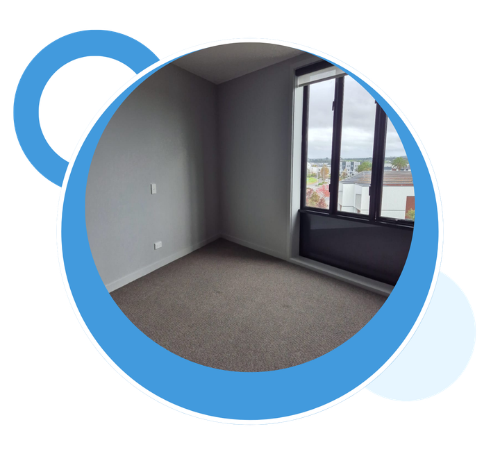 An empty room with a window and a blue circle around it.