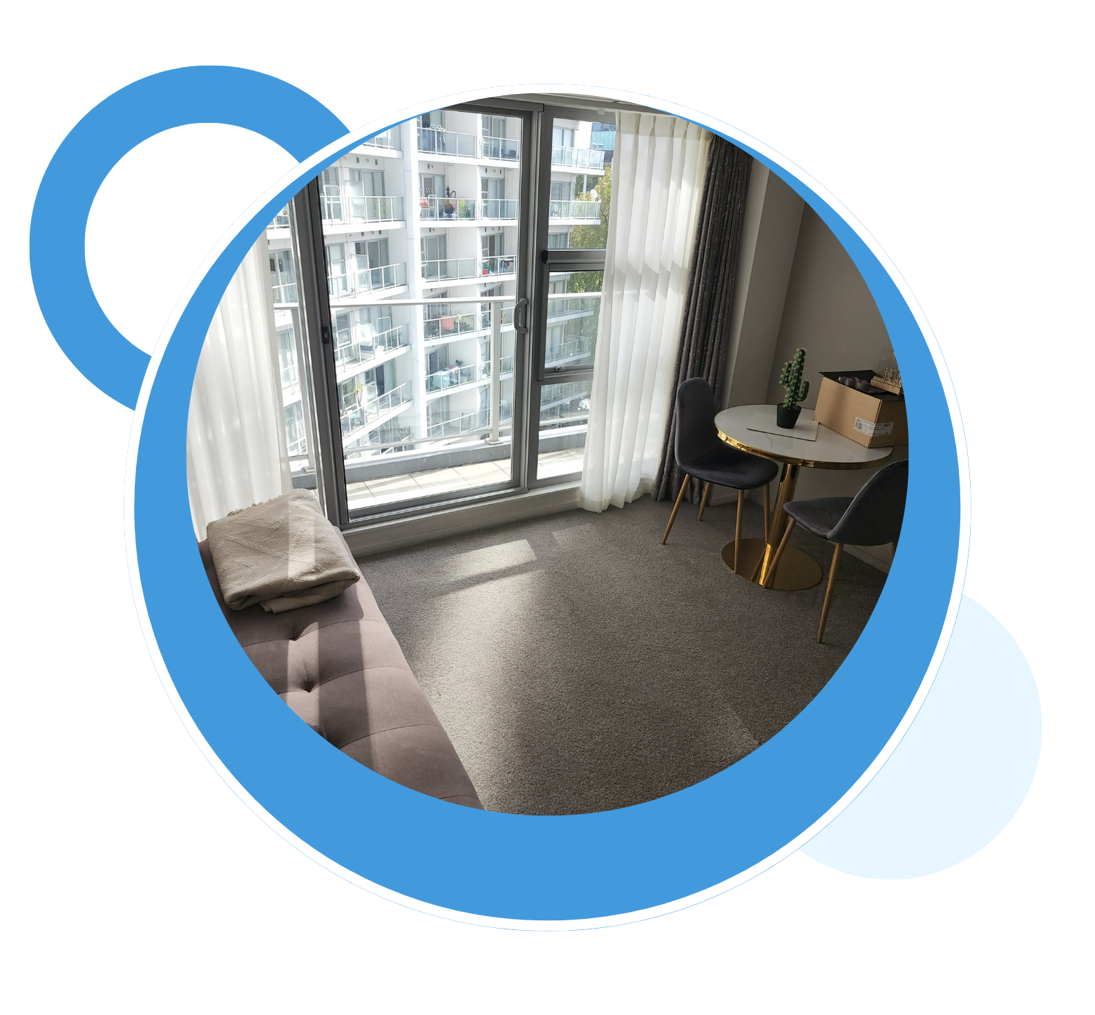 A living room with a couch and a table in a blue circle.