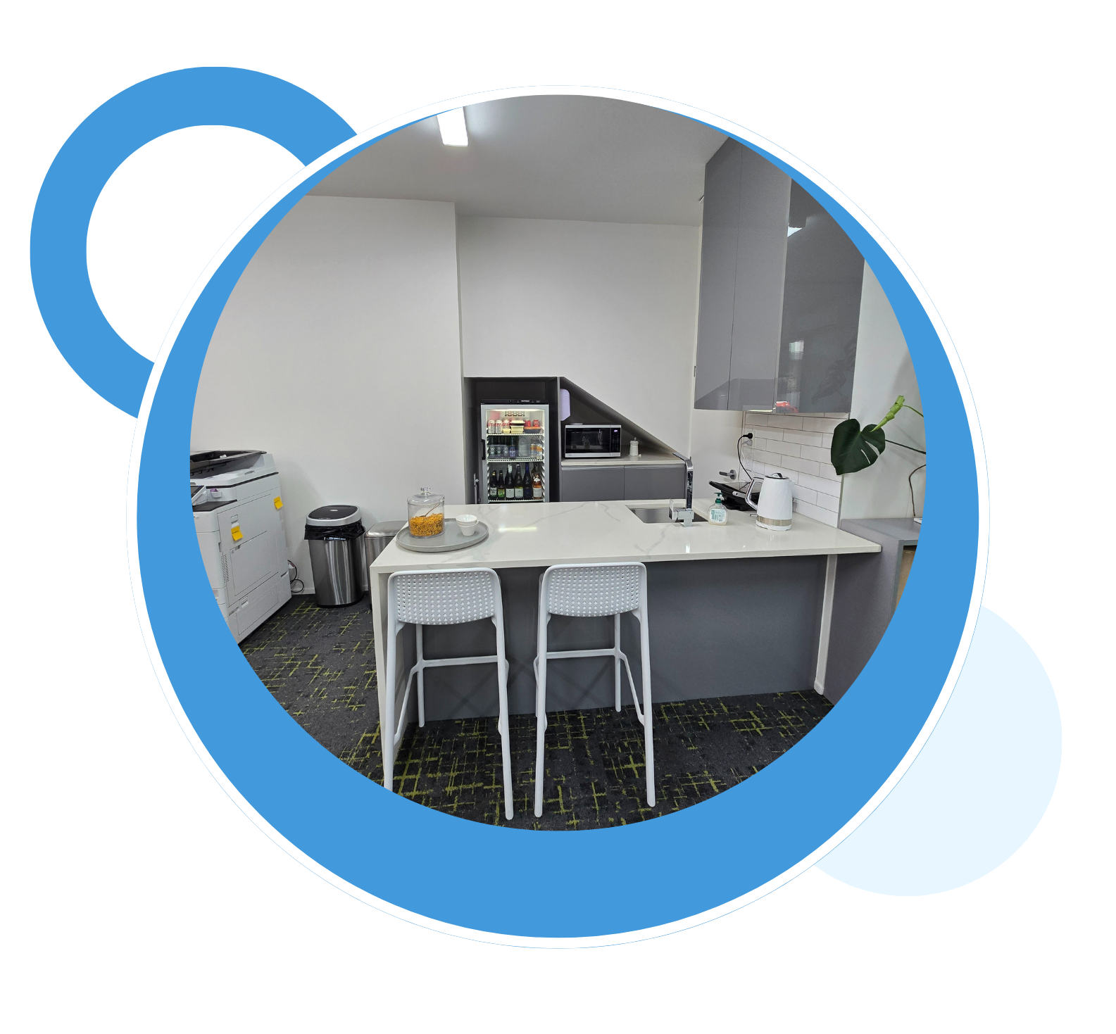 A kitchen with a table and chairs in a blue circle.