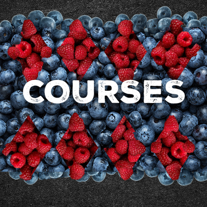 The word courses is written on a pile of blueberries and raspberries.