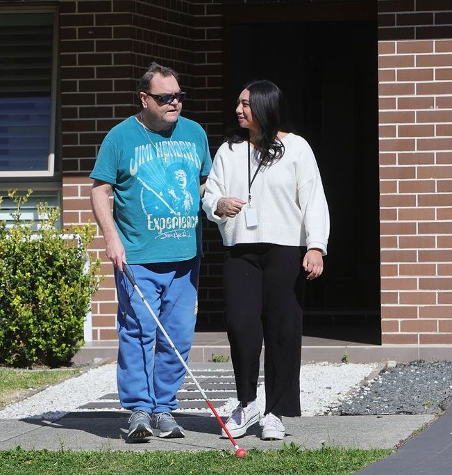 A man wearing a shirt that says engineers is walking with a woman
