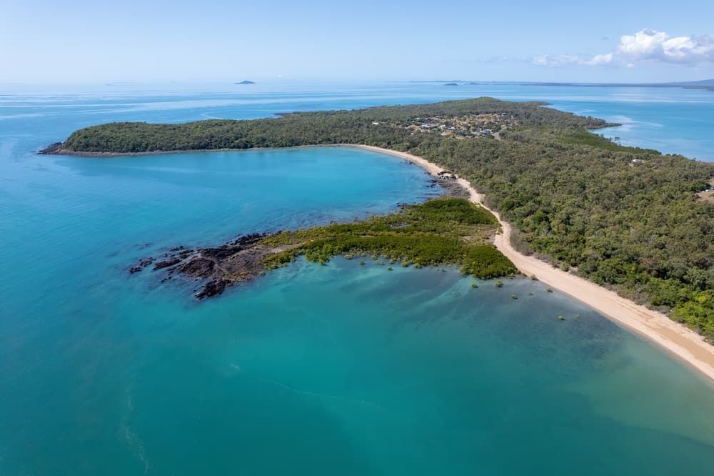 An Aerial View Of A Small Island In The Middle Of The Ocean — Health Hub Mackay In Sarina, QLD