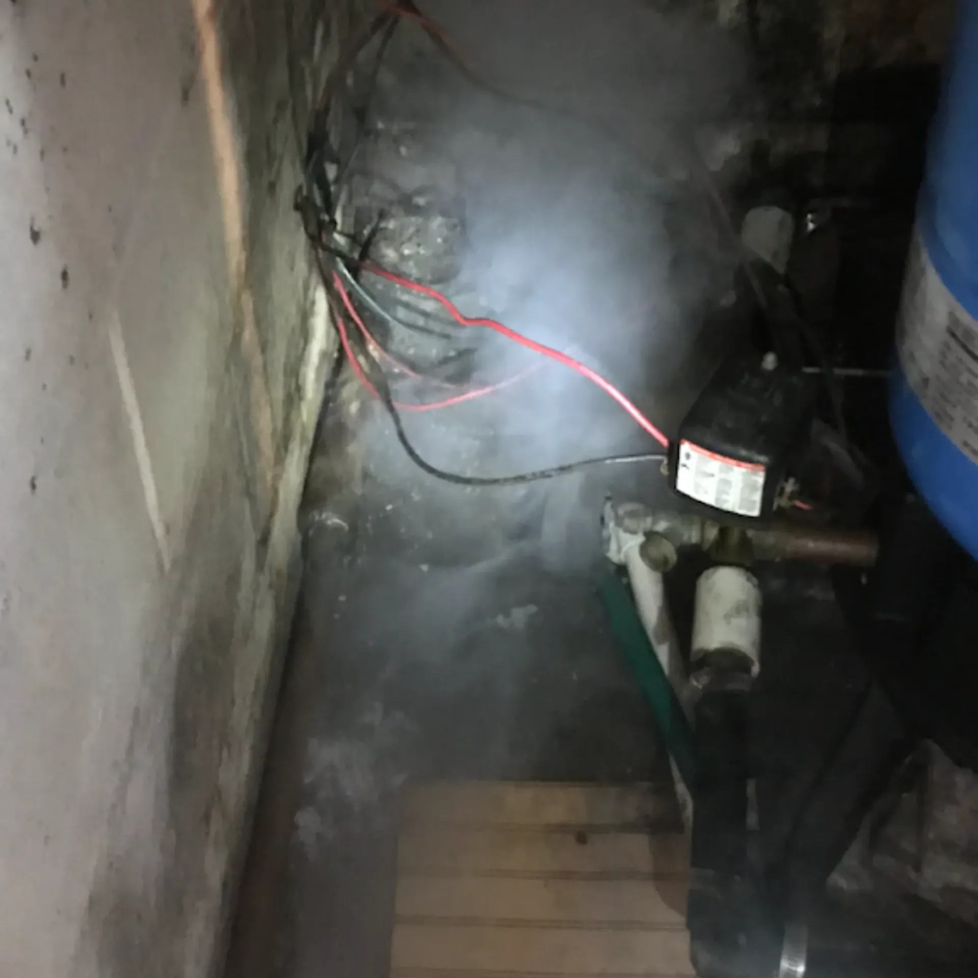 Affordable Waste Services - Smoke is coming out of a pipe in a room