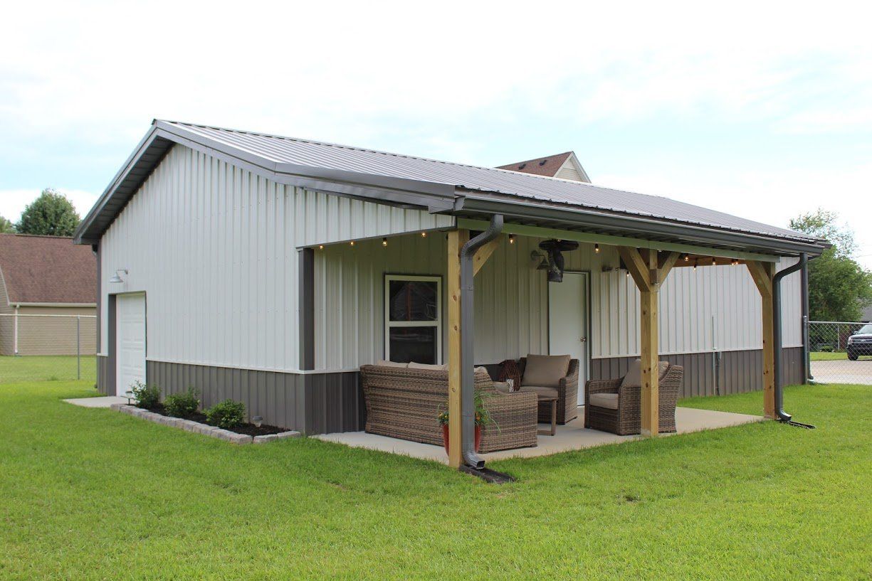 Light grey shed with patio furniture and beams