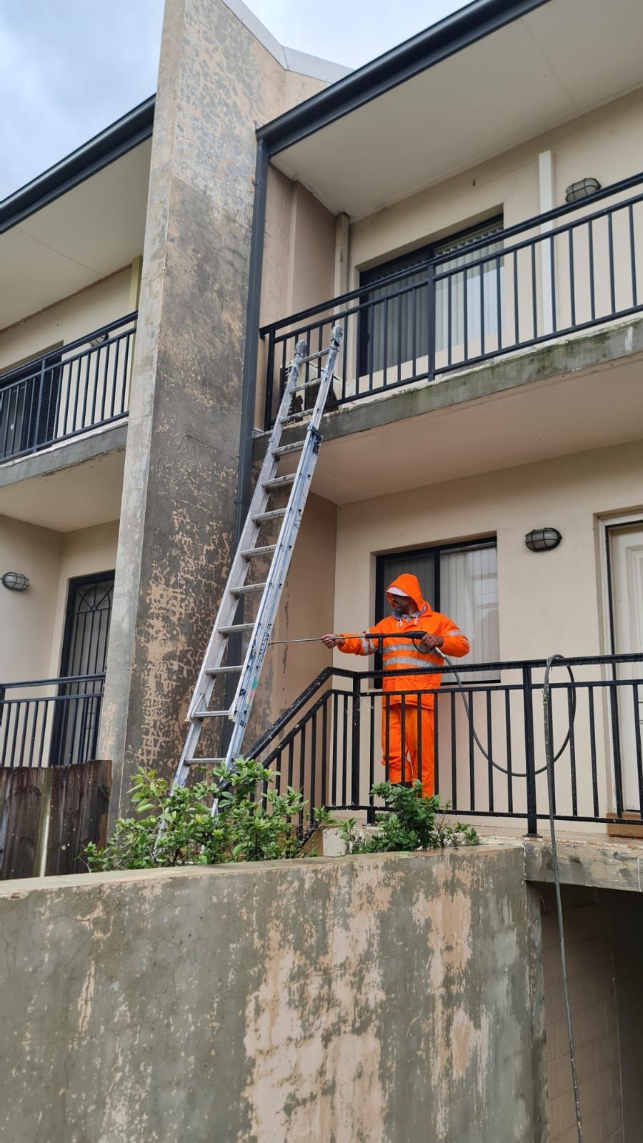 Man Painting Outside the Residential Building - Sydney, NSW - Marano Painting Pty Ltd