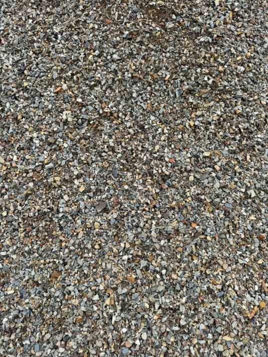 A Pile of Gravel is Sitting on the Ground — Leichhardt River Nursery & Skip Bin Hire In Kalkadoon, QLD