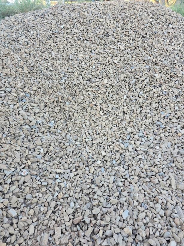 A Pile of Gravel is Sitting on the Ground in a Field — Leichhardt River Nursery & Skip Bin Hire In Kalkadoon, QLD