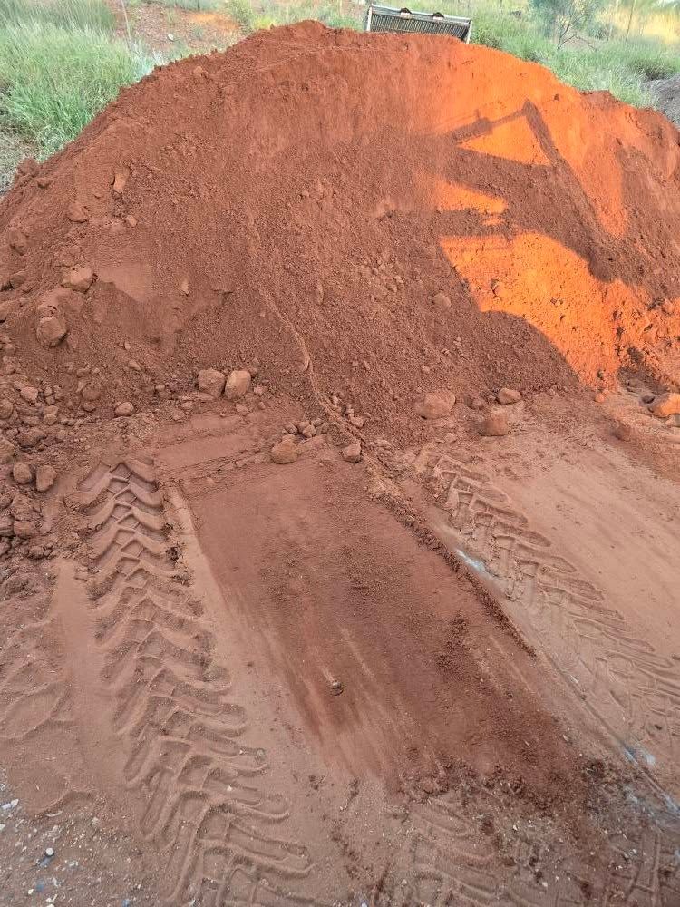 A Pile of Dirt With Tire Tracks on the Ground — Leichhardt River Nursery & Skip Bin Hire In Kalkadoon, QLD