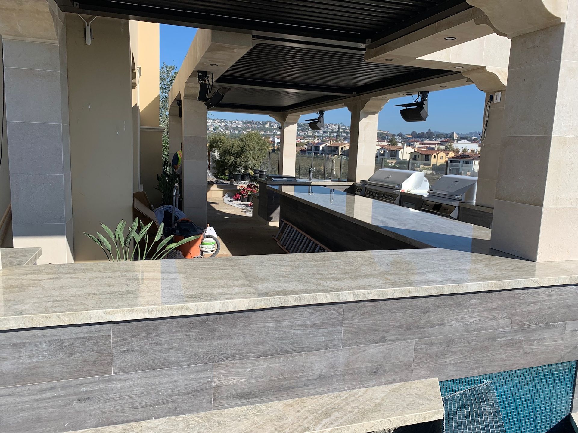 A view of a city from a balcony overlooking a pool in San Diego.