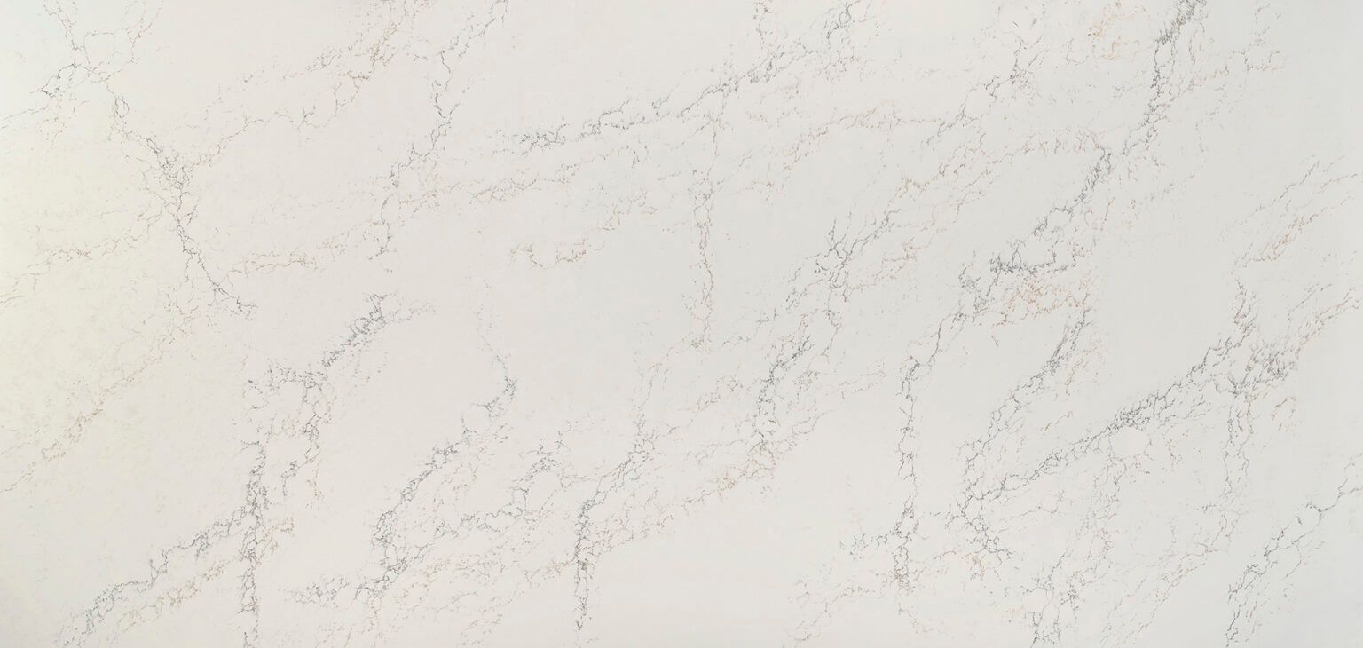 A close up of a white marble counter top.