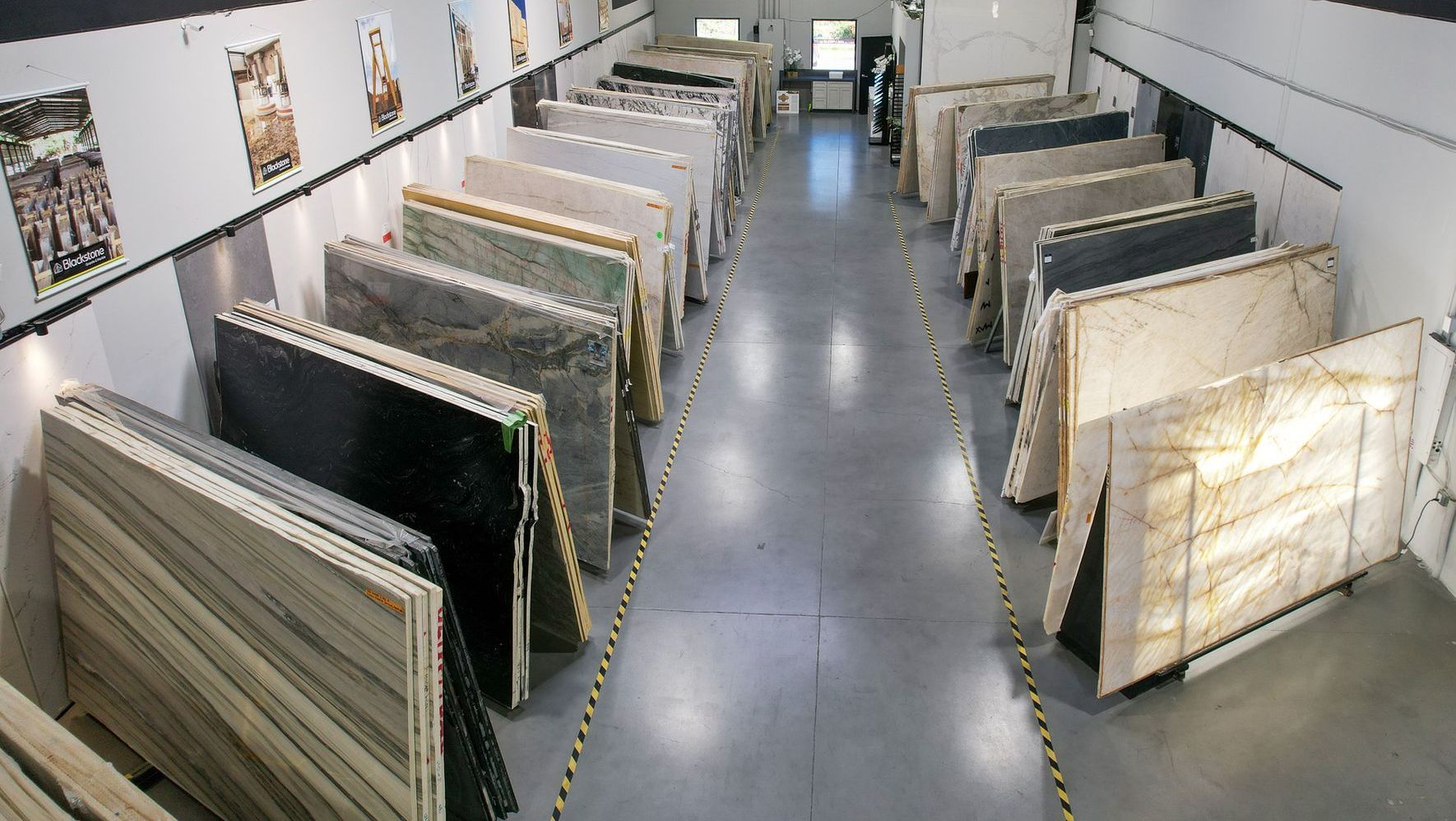 A large warehouse in Vista California filled with lots of marble slabs.